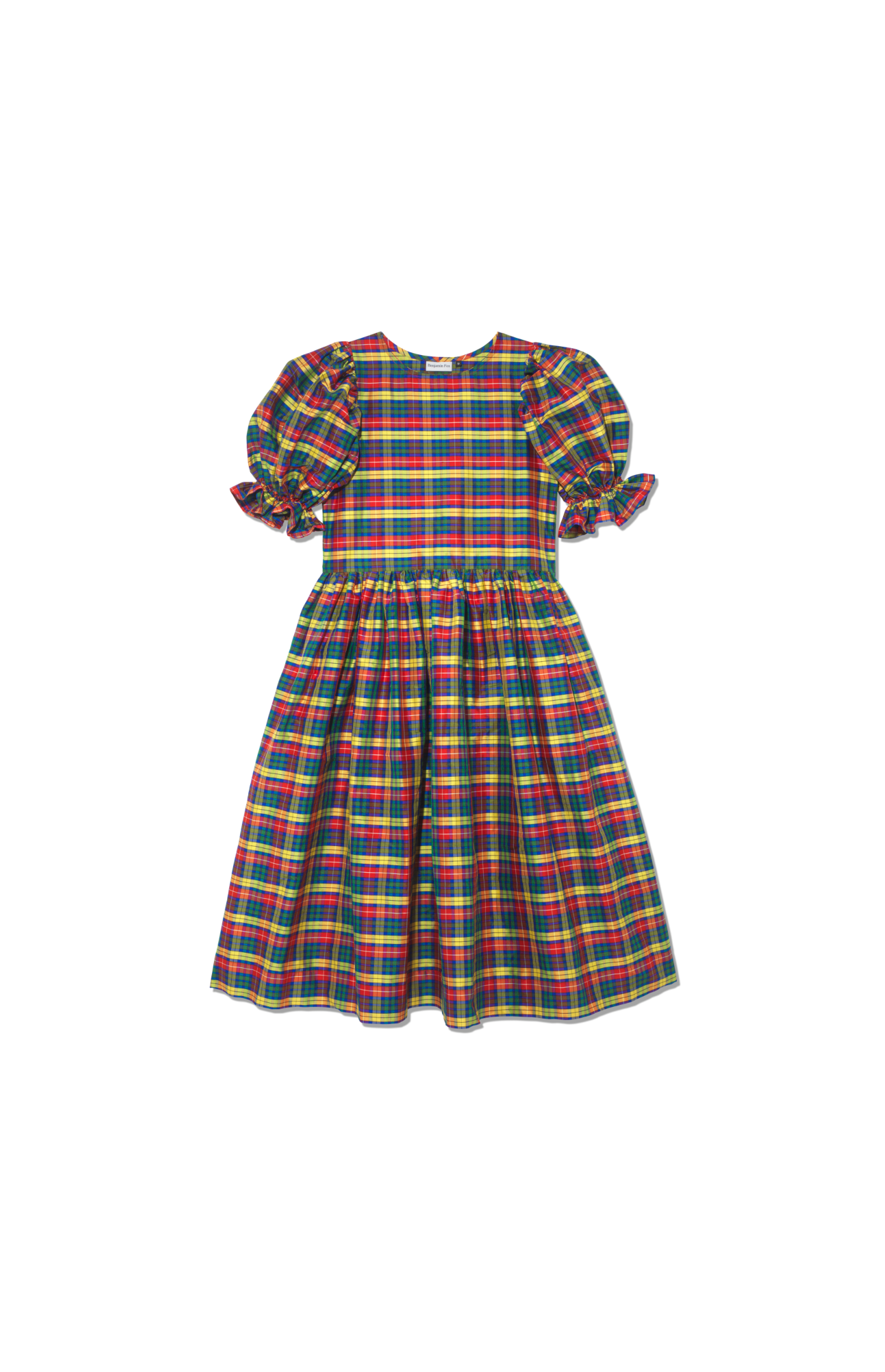 Designer custom made silk dress flat lay. With tiered skirts and puff sleeves, this beautiful handmade dress has an oversized silhouette