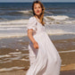 Embroidered white dress full length with scallop edge on the sleeve hem and the skirt. 