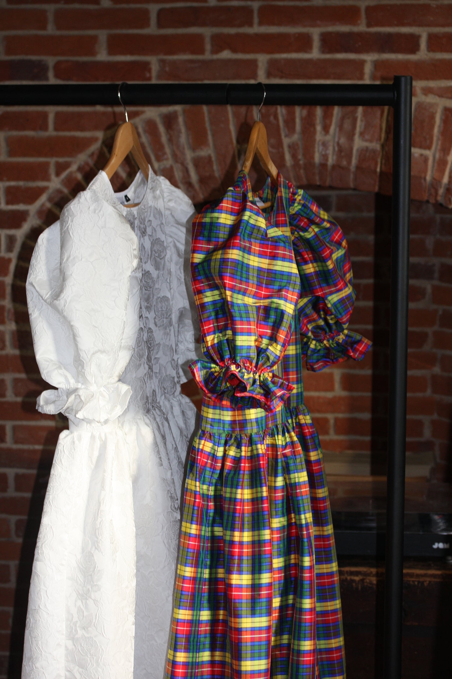 Romantic and nostalgic and beautiful dream dress in silk tartan and an ex deigned Italian jacquard. Both dresses have large puff sleeves and a full hand gathered tiered skirt