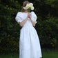 Full length image of white jacquard floral wedding dress with large puff sleeves