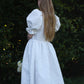 Back view image of white textured floral dress