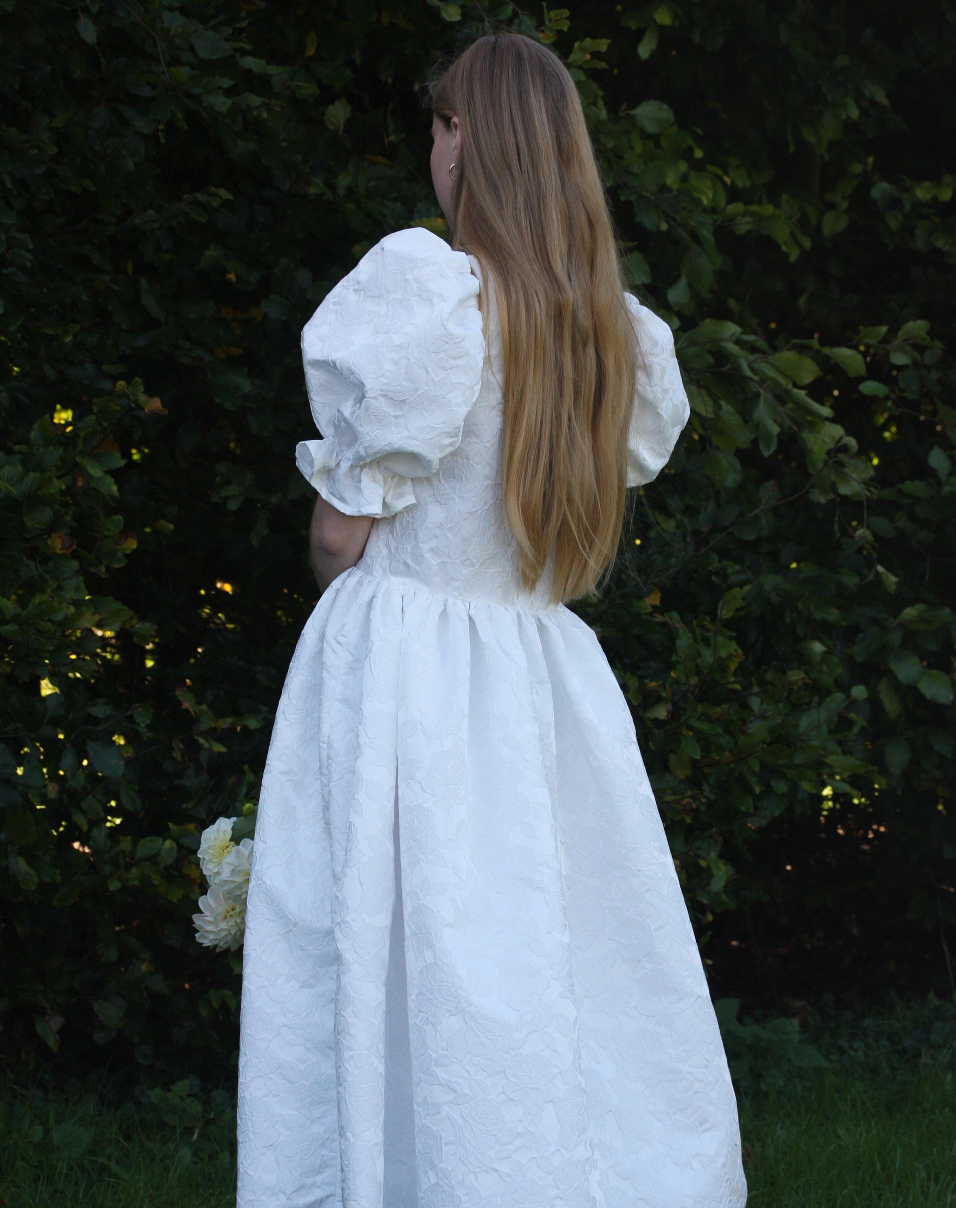 Back view image of white textured floral dress