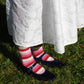 Hand knit wool socks in pink and red stripe