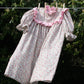 summer mini dress in pink floral with ruffle neckline and puff sleeves 
