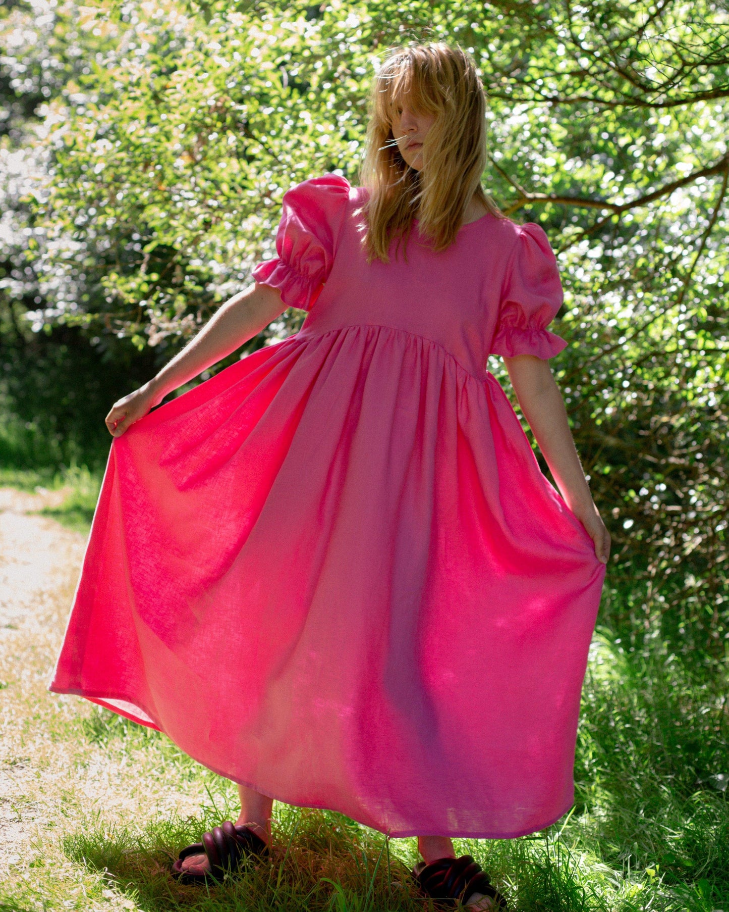 Full length image of perfect wedding guest dress in bright hot pink
