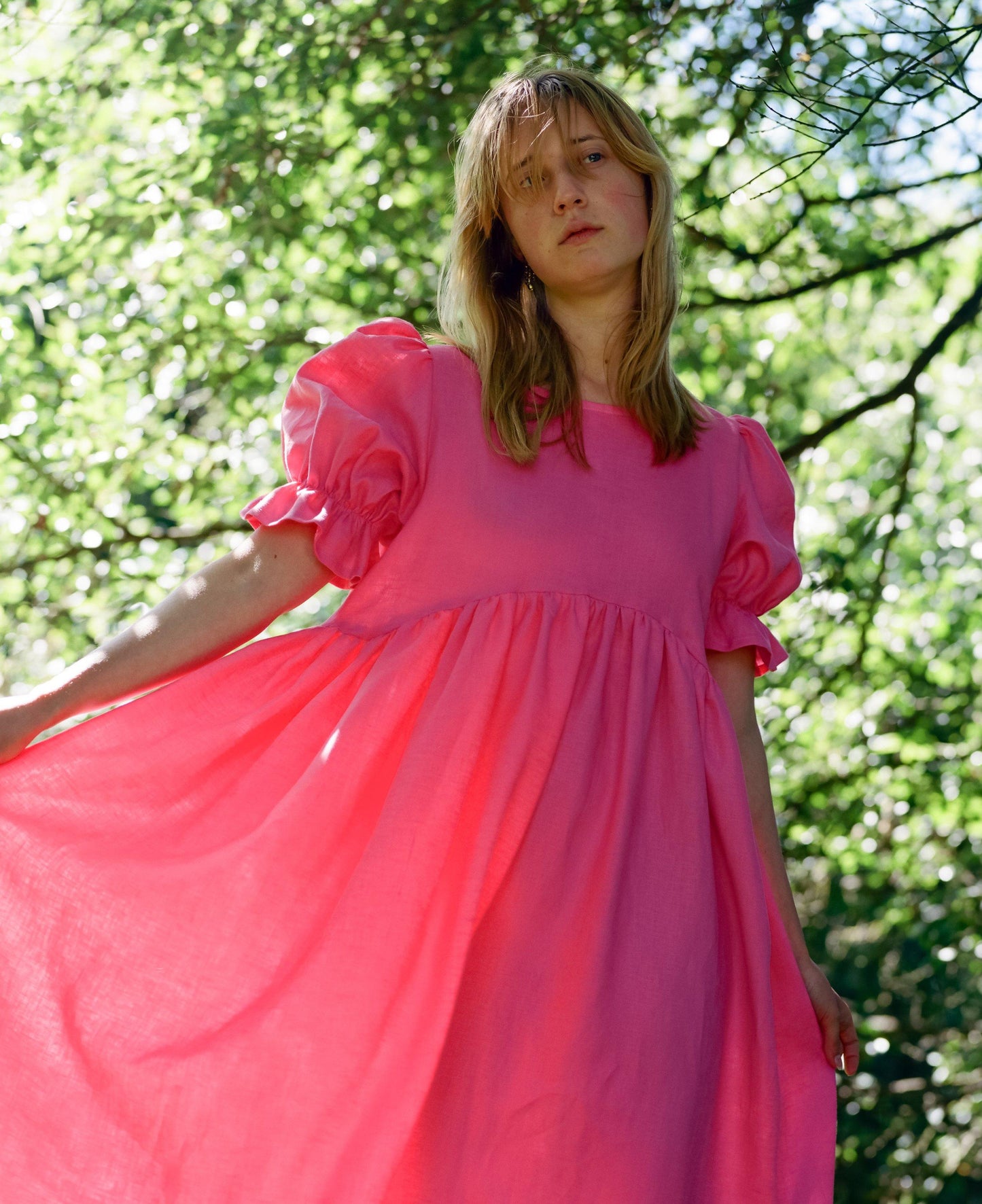 Soft linen dress in bright pink, handmade by a small independent designer in the UK