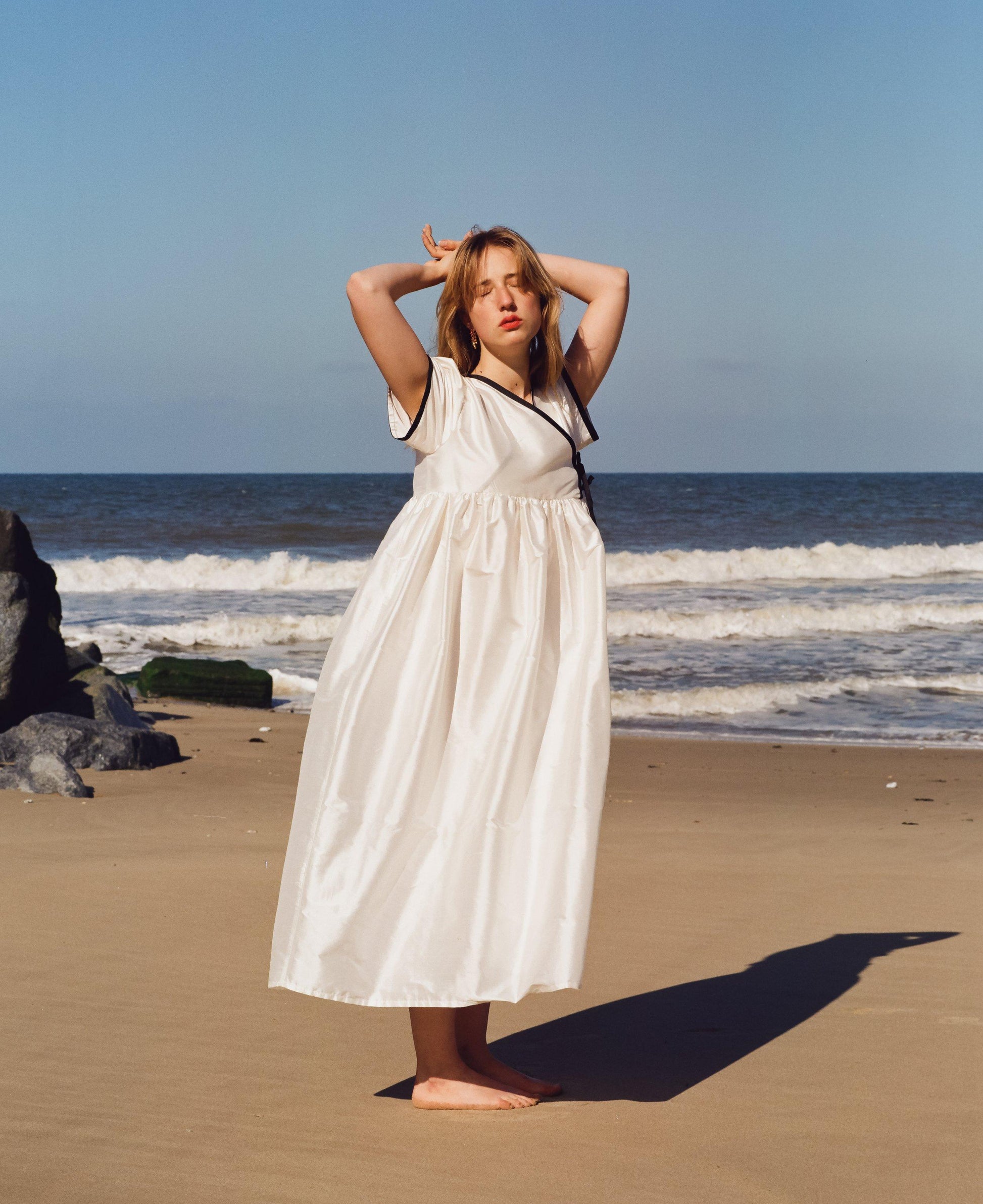 Full length image of womens dress made from cream silk dupion 