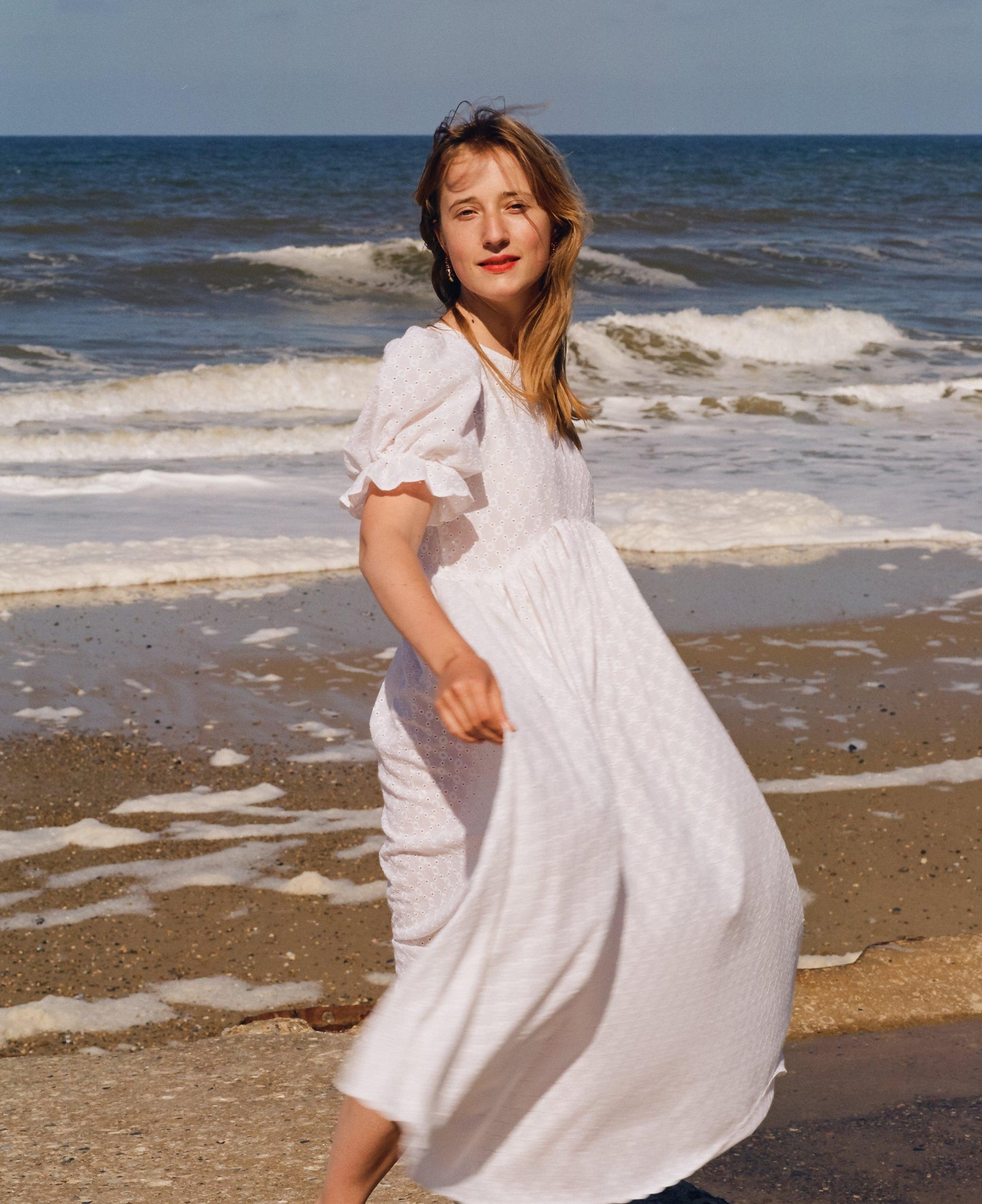 Embroidered white dress full length with scallop edge on the sleeve hem and the skirt. 