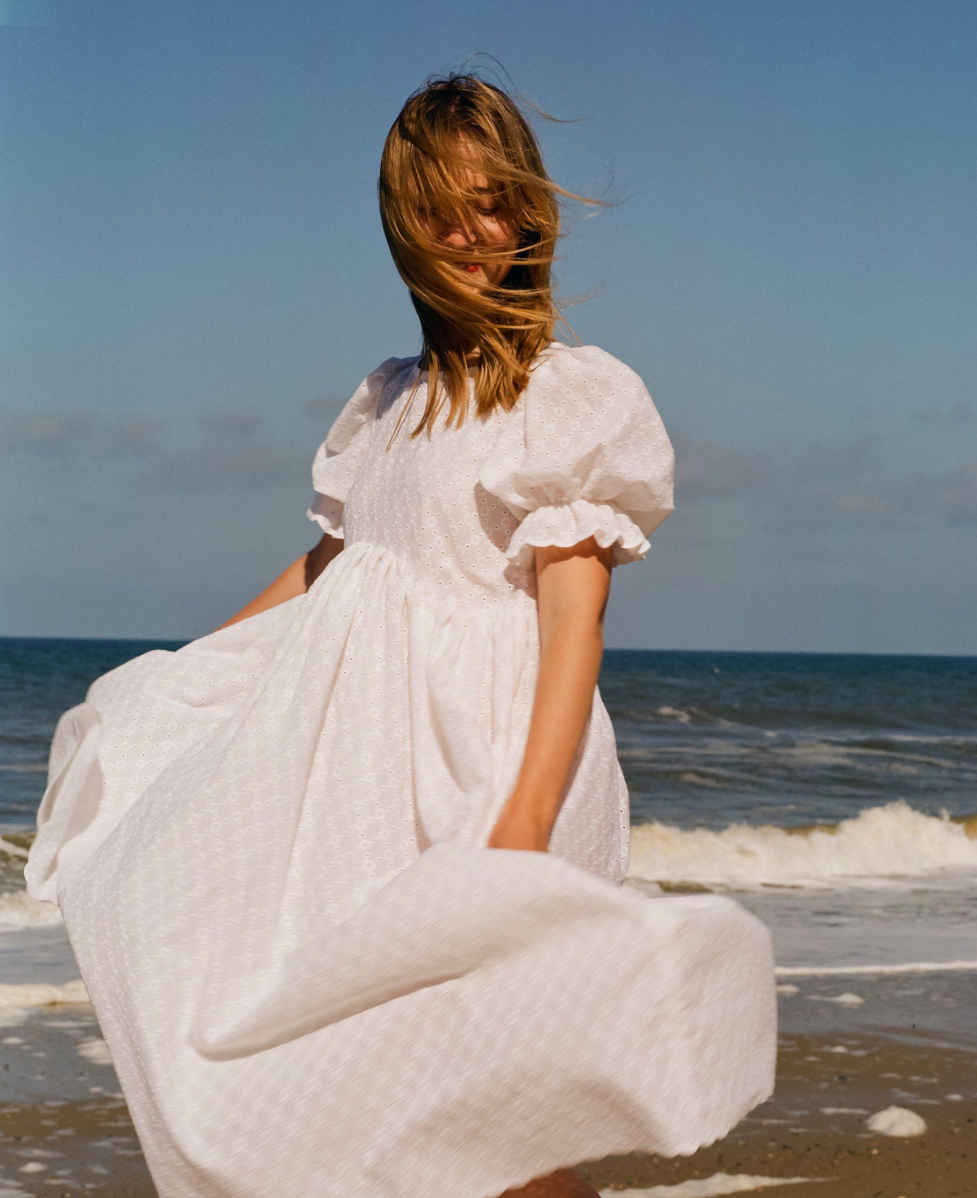 Puff sleeve white dress in broderie anglaise. Handmade with lightweight quality designer fabric 