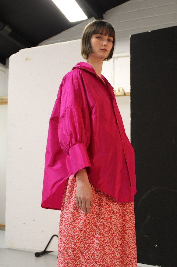 Oversized ladies button up blouse in pink fuchsia magenta silk dupion with a large collar and cuffs and puff sleeves 